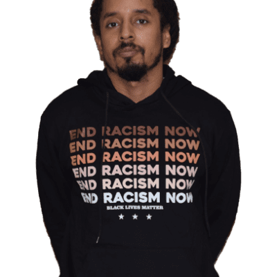 A man wearing a black hoodie with the words " end racism now ".